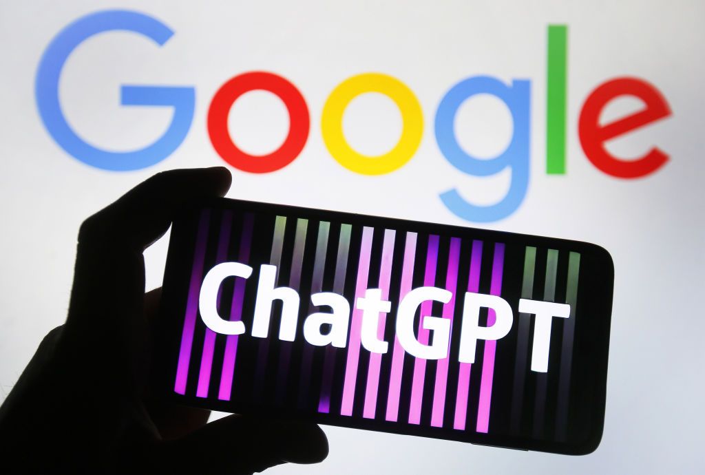 ChatGPT on a phone in front of a Google logo.